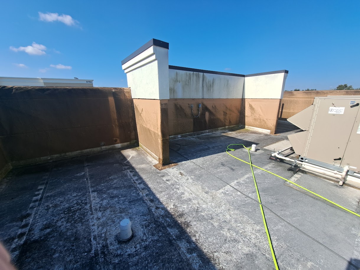 Commercial roof and wall before cleaning
